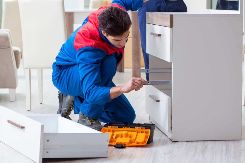 A professional mover is assembling a furniture