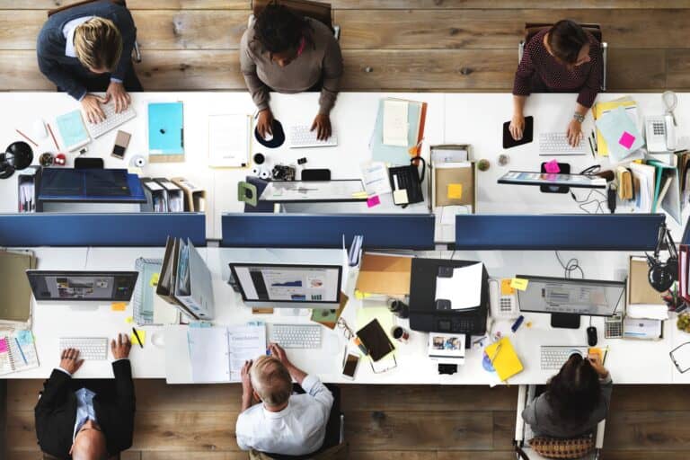 High-angle shot of a busy office in the concept of 'How to Minimise Disruption During an Office Move'.