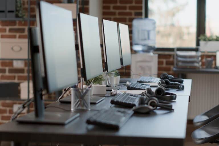 Closeup of workstations with office electronics in the concept of 'How to Pack Office IT Equipment and Electronics'.