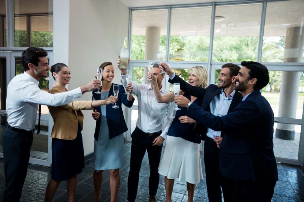Company executives celebrating the success of the office relocation