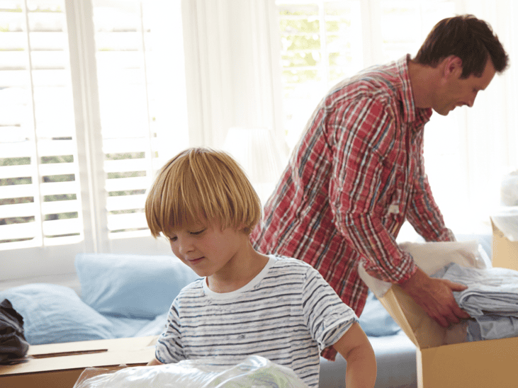 A Father and Son Packing for Their House Relocation in The Living Room